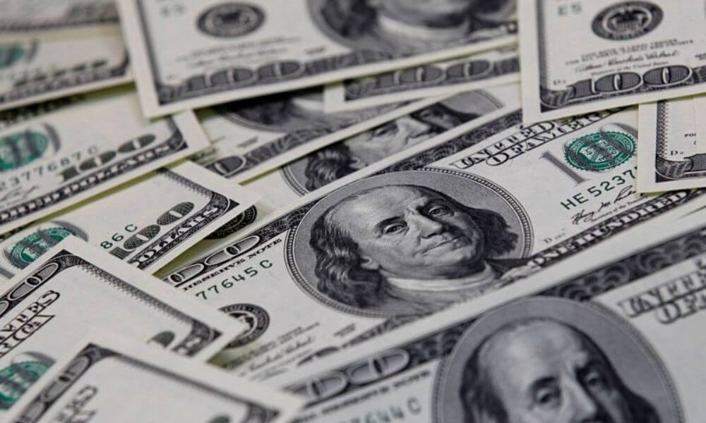 Dollar slumps ahead of US inflation data, sterling rises